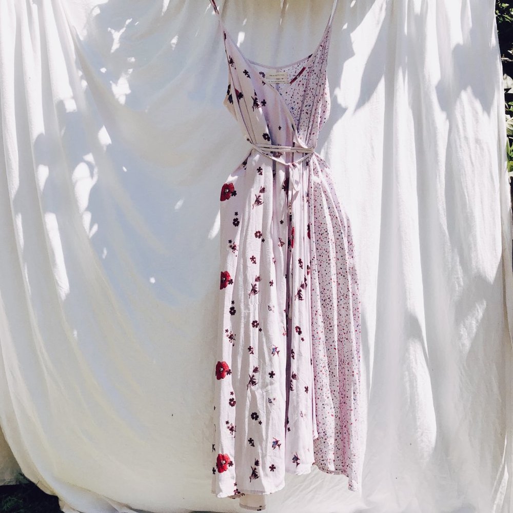 Lilac crossover summer dress with floral pattern.